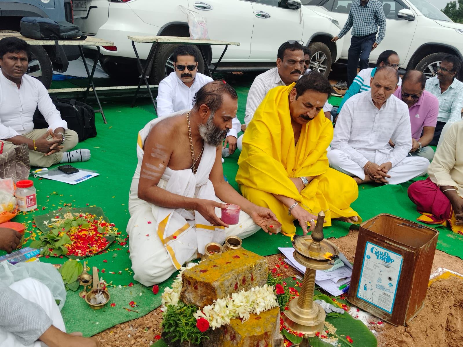 Lamp-lighting ritual at the Bhoomi Pooja